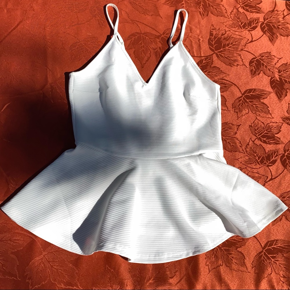 Cute, white, size-medium top! Perfect for a night out!